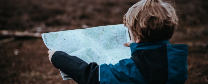 Behavioural freedom: young boy with map